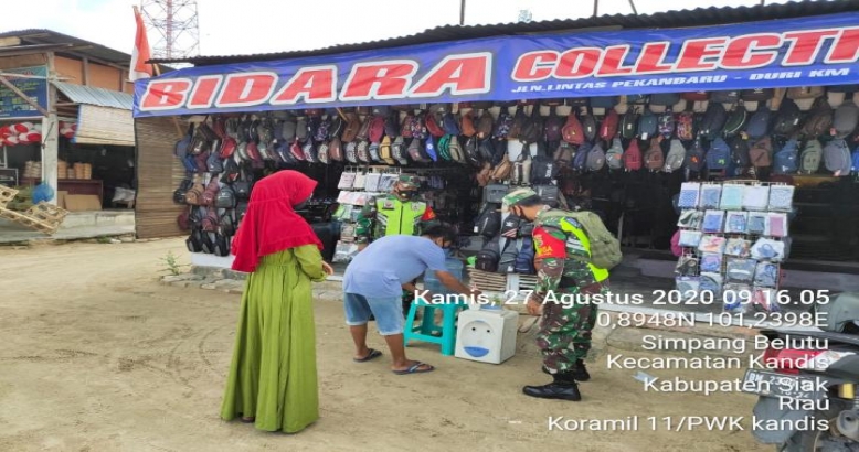 Areal Pertokoan Kelurahan Simpang Belutu Tempat Aktivitas Warga Mendapatksn Sosialisasi AKB